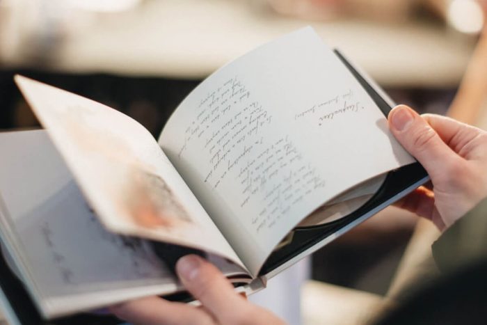 Someone flipping through a book book-17@2x